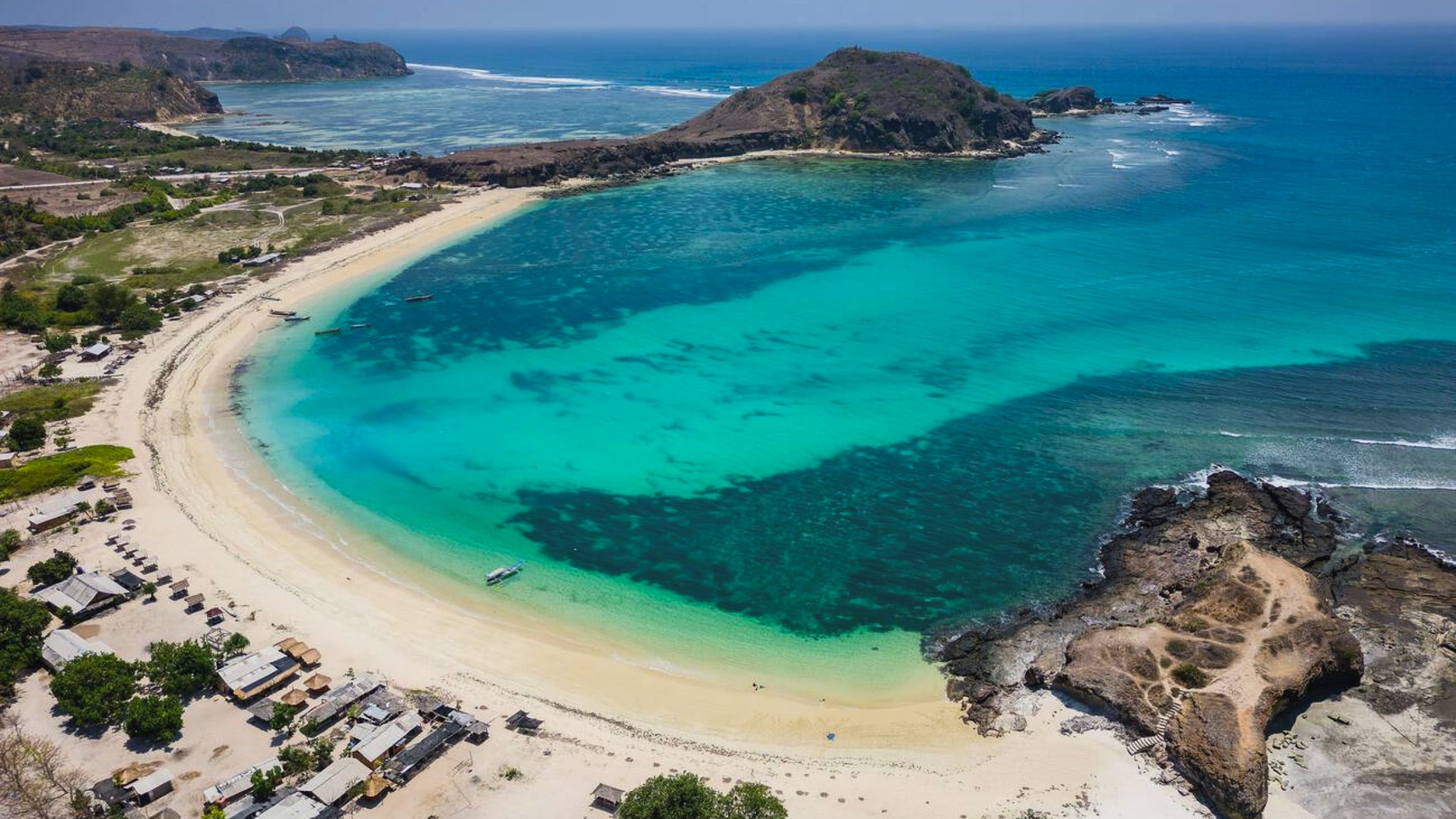 Aerial view of Tanjung Aan bay and its curved white sand beach, Lombok